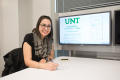Photograph: [Woman Smiling for Photo at UNT's New College]