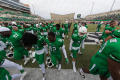 Photograph: [Mean Green Football Players on field]