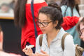 Photograph: [Student eats decorated cookie]