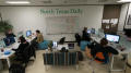 Photograph: [NT Daily staffers working during a late night]