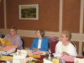 Photograph: [Board members reviewing documents at CSLA conference]