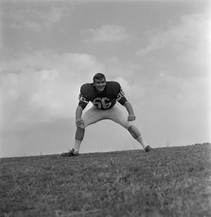 Primary view of [North Texas State football player number 56 in a field]