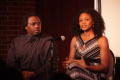 Photograph: [Kimberly Elise speaking to audience with Curtis King on stage]