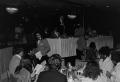 Photograph: [Photograph of unidentified guests sitting at dining tables and confe…