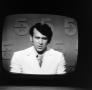 Photograph: [Ron Spain on television]