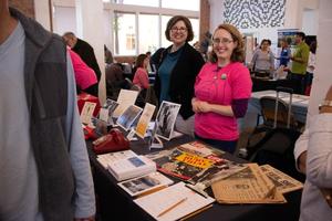 Primary view of [Faculty members of the Sixth Floor Museum at their display table, 2]