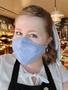 Photograph: [Katy Allred wearing a face mask while working at LUCH in Houston]