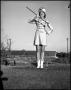 Photograph: [Marching Band Majorette on Field]