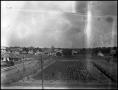 Photograph: [Campus - Aerial - View Across Fields and Houses to Denton Courthouse]