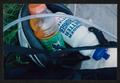 Photograph: [Bottles in a riders helmet: Lone Star Ride 2002 event photo]