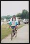 Photograph: [Smiling cyclist: Lone Star Ride 2004 event photo]