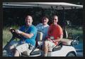 Photograph: [Three crew members sitting in a golf cart: Lone Star Ride 2002 event…