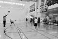Photograph: [Student 2 takes shot during intramural three-point contest]