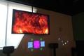 Photograph: [Tv scree with image of fire, College of Music at the Perot Museum]