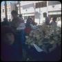 Photograph: [People standing around piles of fruit in Concepción]