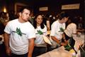 Photograph: [Student volunteers pass out items at UNT rebrand unveiling]