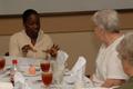 Photograph: [Shavsha Davis and Elsie Wiley converse at 2006 SVCI Luncheon]