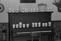 Photograph: [Cups on a piano at the home of Willard Watson, "The Texas Kid", 1]