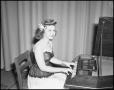 Photograph: [Woman playing the harpsichord]