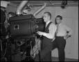 Photograph: [Three Men Working in a Projection Room]