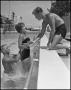 Photograph: [Lifeguard with Two Students Swimming}