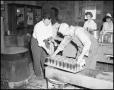 Photograph: [People canning food at NTSTC canning plant]