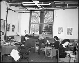 Primary view of object titled '[Staff in the student newspaper office]'.