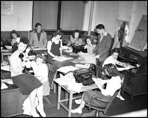 Primary view of object titled '[Students in Newspaper Office]'.