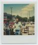 Photograph: [Portrait of One Man Shopping Outdoors]