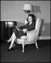 Photograph: [Woman seated in an armchair]
