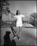 Photograph: [Female Student Playing Tennis]