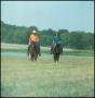 Photograph: [Medium Shot of Two Riders on Horses, "Phinney"]
