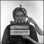 Photograph: [Portrait of Lewis Abernathy behind a clapperboard, 2]