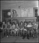Photograph: [Students and teacher at the front of class]