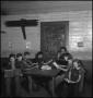 Photograph: [Students reading at table]