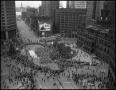 Photograph: [Aerial image of a parade in downtown, 2]