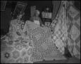 Photograph: [Two women showing off their quilts]