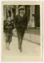 Photograph: [Frank Cuellar Sr. and Frank Cuellar Jr. walking]