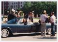 Photograph: [Actors and film crew prepare for motorcade scene in "JFK"]