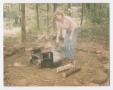 Photograph: [Woman Dousing a Campfire]