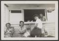 Photograph: [4 People Outside Concession Stand]