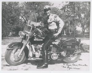 [Abilene Police Officer Bryan Wason on a Motorcycle]