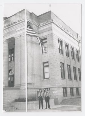 [Two Officers in Front of the First Abilene Police Department]