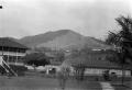 Photograph: [Buildings in Front of Hills]