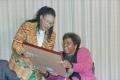 Photograph: [Barbara Jordan and Zenani Mandela Dlamini Holding a Wooden Frame]