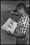 Photograph: [Football Player With Newspaper]