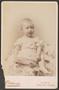 Photograph: [Photograph of a Baby in a Short-Sleeved Dress]