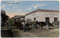 Postcard: [Oxen carts in front of pawn shop]