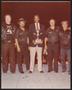 Photograph: [Lee Brown Holding a Trophy with Four People]