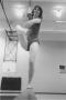Photograph: Female Gymnastics Student Performing on Balancing Beam
